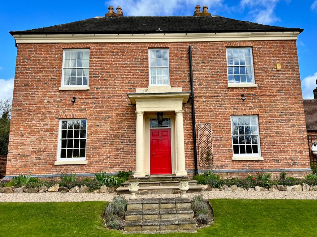 Red door on brick house