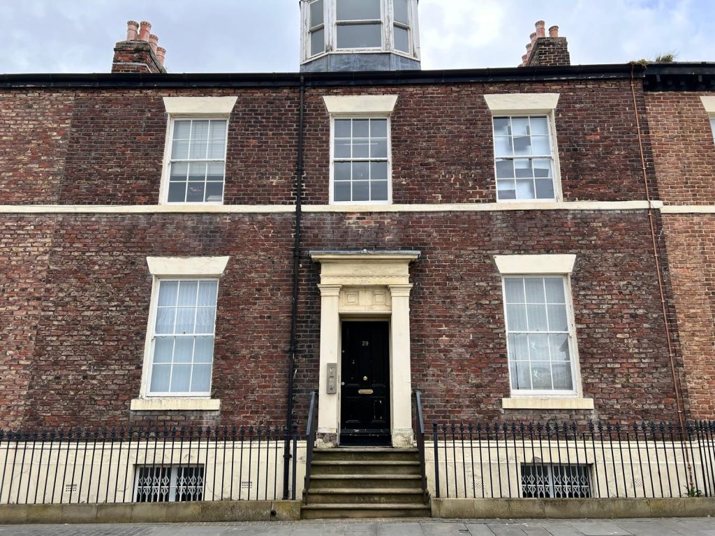 Brick house with white trim