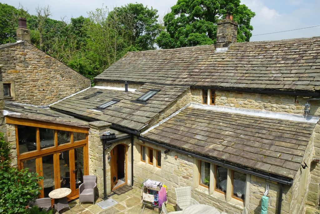 Stone house with sloped roofs